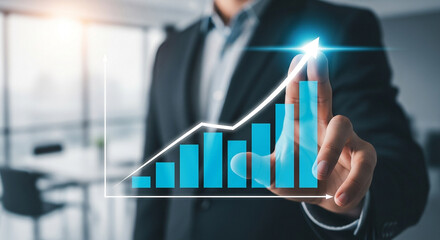 A businessman points to a glowing upward trending bar graph, symbolizing business growth and financial success
