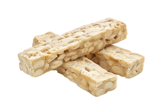 Raw tempeh blocks made from fermented soybeans on white background