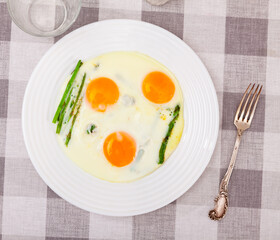 Homemade healthy breakfast: fried eggs and asparagus