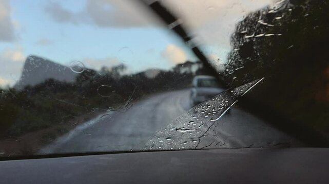Raindrops on Car Windshield in Rainy Weather
