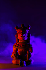 Ancestral pre-Columbian ceramic figure in an ethereal scene, surrounded by a spiritual atmosphere