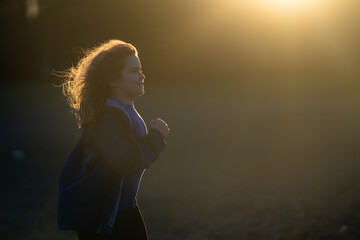 Sport kids. Child running. Kids jogging in the park. Child enjoying a run. Teen runner in motion....