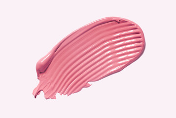 Blusher or lipstick creamy texture red orange cosmetic smudge isolated on white pink background