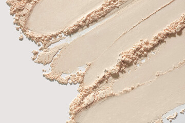 Makeup liquid foundation medium color tone smudge blur cream background. Cosmetic beauty product...