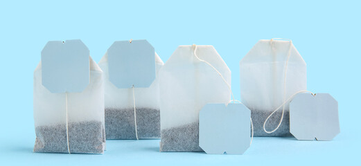 Tea bags on blue background, closeup