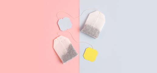 Tea bags on color background, top view