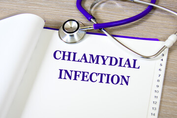 CHLAMYDIAL INFECTION - words on a white sheet against the background of a stethoscope