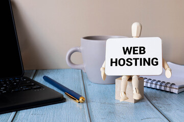 Web Hosting the inscription appearing behind the torn cardboard paper.