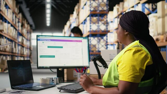 Black woman processing orders next to AI-generated brain for tracking software, using computer to register tracking numbers barcodes. Artificial intelligence supporting shipments. Camera A.