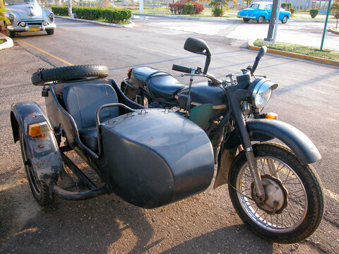 Fototapeta Vintage Motorcycle with Sidecar Parked on a Street of Cuba