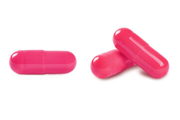 Red pills isolated on white background