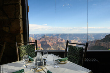 Dining room table with a view into the Grand Canyon from the historic lodge on the north rim of Grand Canyon National Park, summer vacation, Arizona, USA
