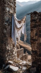Old Cloth Hanging on Stone Wall Ruins in Mountain