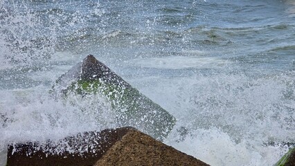 Water flowing into the breakwater.