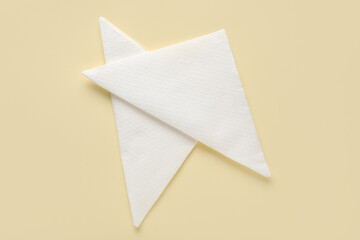 Paper napkins on beige background