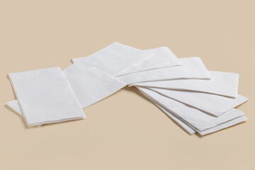 Paper napkins on beige background
