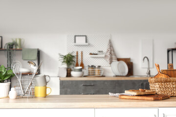 Different utensils on table in modern kitchen