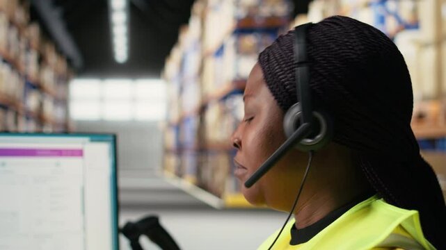 Call center clerk parcel tracking and order dispatch on help line, working in an online shopping logistics center. Worker resolving cargo issues and packages lost in distribution process. Camera A.