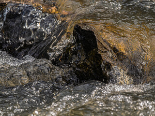 Smooth Water Fast Bubbling Past The Rocks