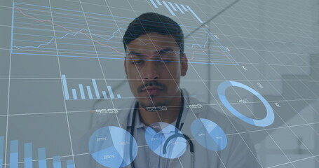 White coat doctor examining holographic charts in clinical room, with virtual data and stethoscope