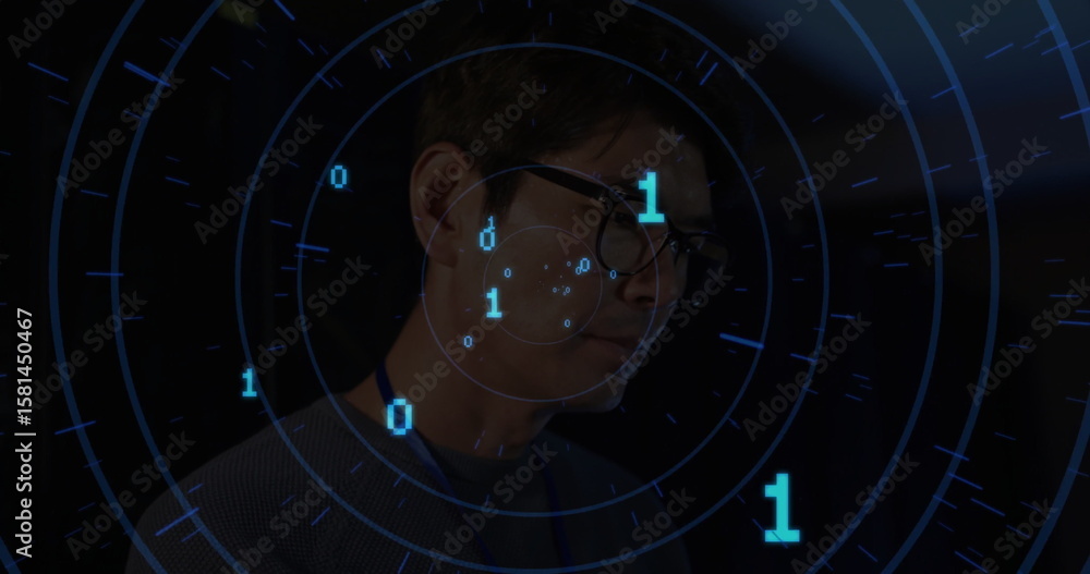 Poster scanning man wearing dark sweater and glasses operating interface in control room, with binary data
