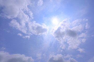 Beautiful blue sky with sun and clouds
