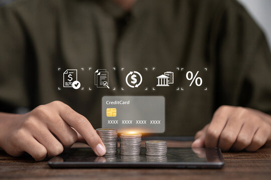 Stacked coins on tablet with credit card and financial icons, digital banking and fintech concept