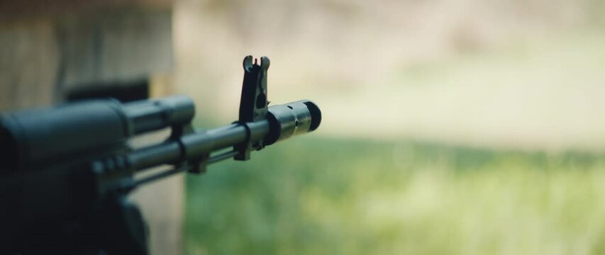Close-up of a rifle muzzle flash as a bullet is fired during outdoor shooting practice