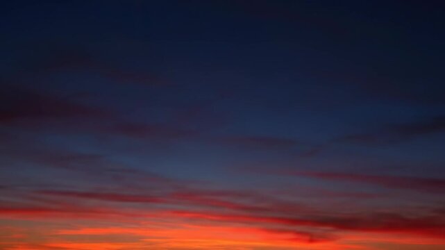 Timelapse of sunset skies moving over the horizon. Late sun and sunflares