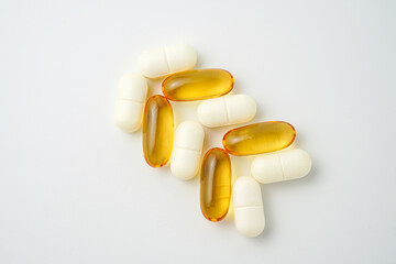 Clock made of pills capsules, pills form a circle, omega, vitamins, Cod liver oil, supplements