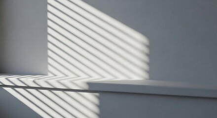 Obraz premium Sunlight Through Window Blinds Casts A Pattern Of Diagonal Lines And Shadows Across A Minimalist White Wall And Ledge, Abstract Background, Product Display, Architectural Detail