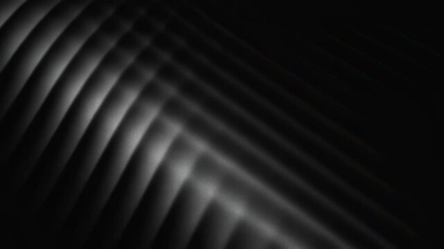 Diagonal pattern of dark lines and shadows creating an abstract moving background. Modern dynamic computer animation.