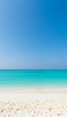 Obraz premium Idyllic beach morning with sunlight on calm water and soft sand