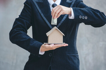Real estate agent hands holding home business mortgage loan investment property. Hands saving...