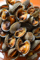 ripe fresh cockle on plate, delicious food in restaurant