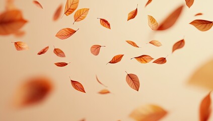 Falling autumn leaves against a pale peach background