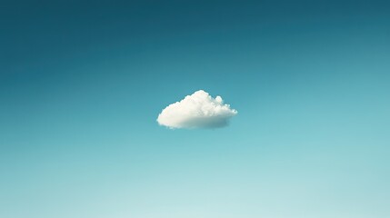 Solitary cloud drifts in vast azure sky