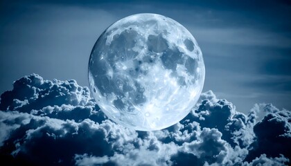 Ethereal full moon rising above a sea of textured, indigo clouds at night