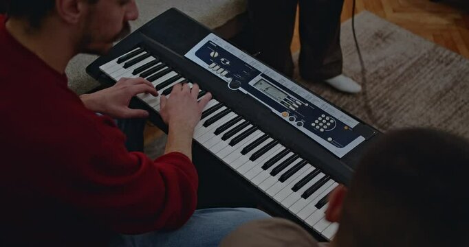 Diverse group of musicians practicing music at home. Playing musical instruments together. Rehearsal, creativity, music band.