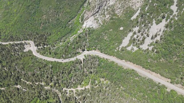 Aerial-Descending over road in Little Cottonwood Canyon, Utah with traffic