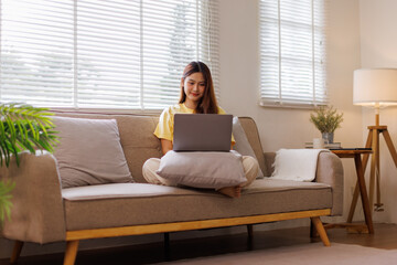 Happy young asian woman or Happy Asian teen girl with her laptop apps, shopping online, reading...