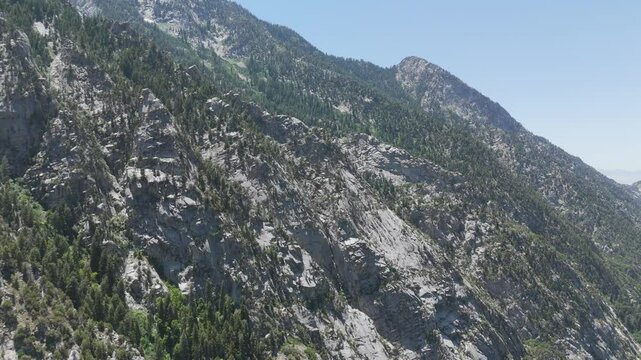 Aerial - Panning view of rugged granite mountain
