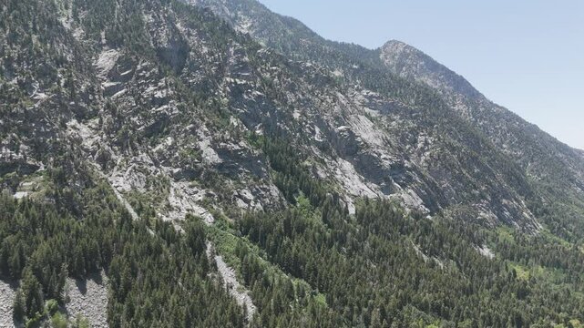 Aerial - Flying toward a granite faces mountain in Little Cotton Wood Canyon, Utah
