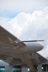 Close-Up of Aircraft Wing with Pitot Tube and Cloudy Sky