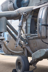 Mounted Gun on Military Helicopter Door with Landing Gear Visible