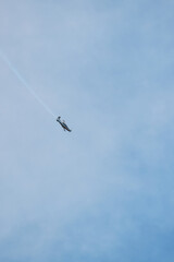 Aerobatic Aircraft Performing Maneuver in Clear Sky
