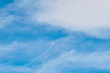 Aerobatic Aircraft Performing Maneuver in Clear Sky