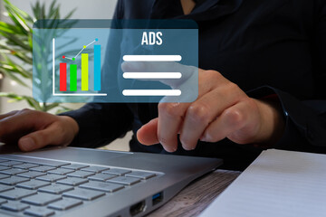 Close-up of a businesswoman's hands working on her computer pointing at an online advertising...