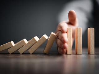 Hand pushing domino chain forward for mesmerizing chain reaction physics demonstration inspiration artistic photography tutorials