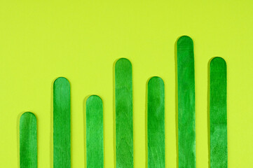 Green colored bar chart on a green background.